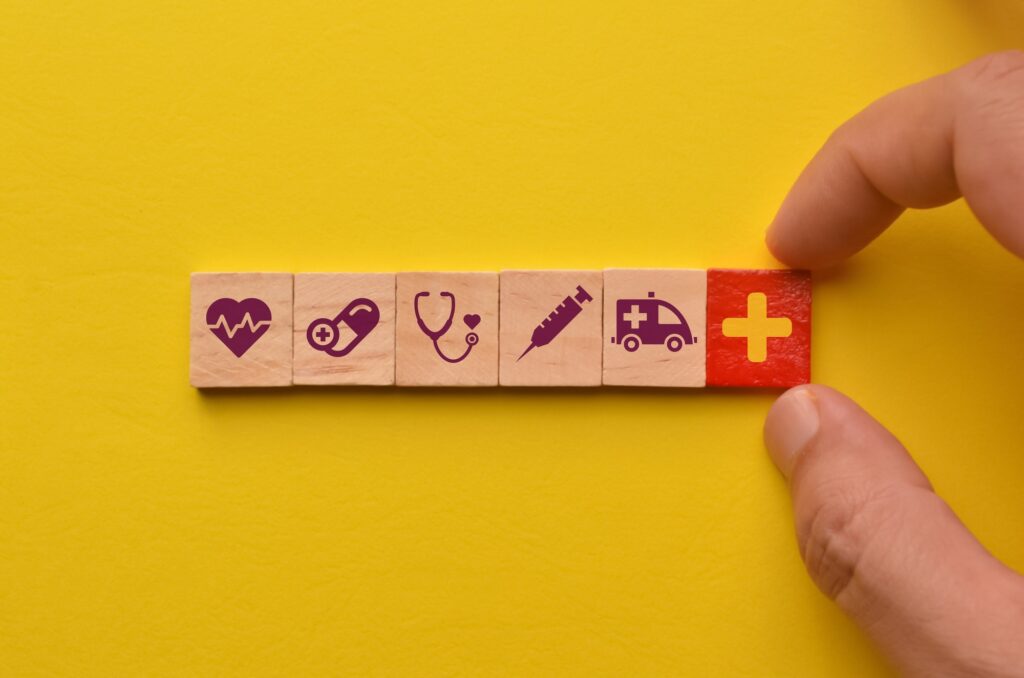 conceptual of healthcare wooden cube blocks with healthcare icons