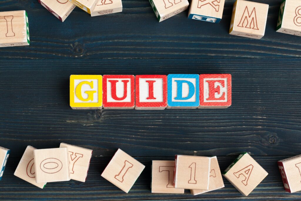 alphabet blocks abc on wooden table text guide