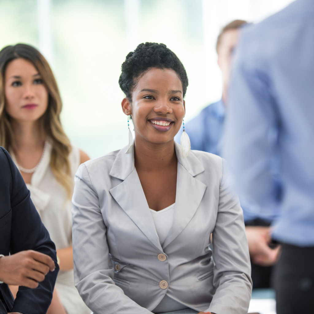 woman smiling while sitting