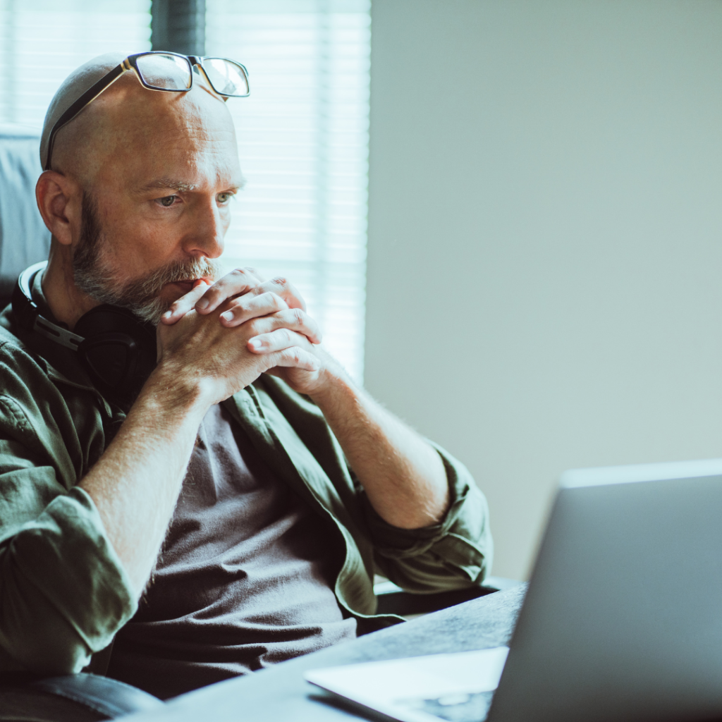 man focusing on his laptop
