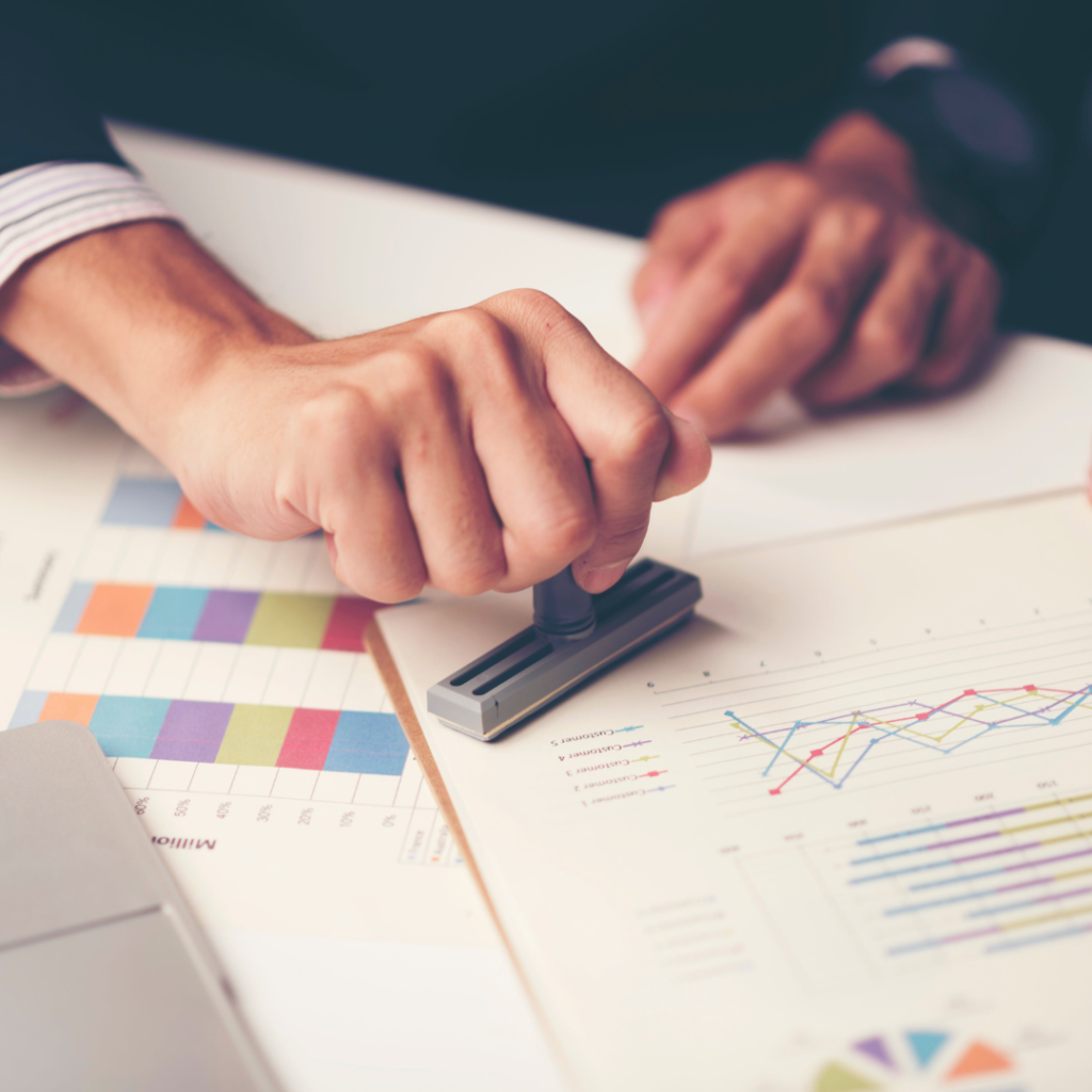 man stamping the paper