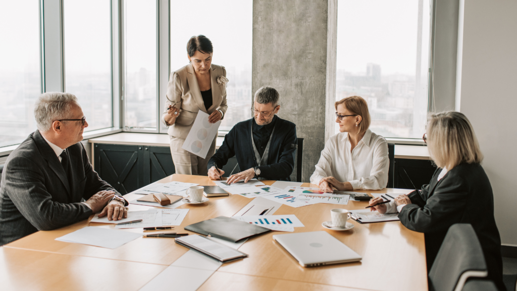 People in office reviewing work